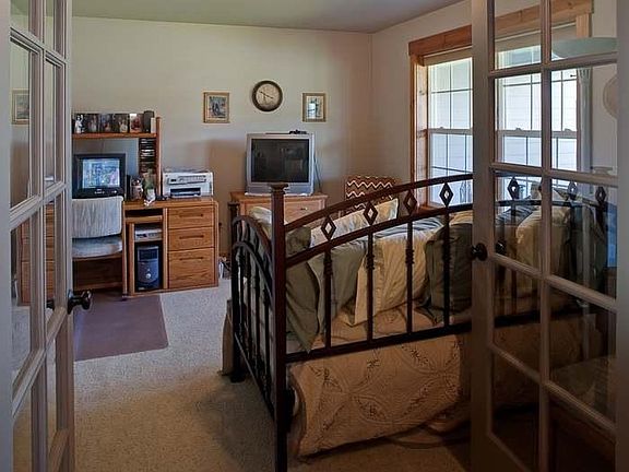Office/den with French doors, could easily be 4th bedroom