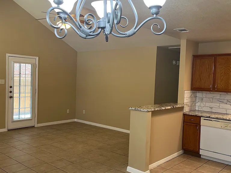view from breakfast area to the door leading to patio