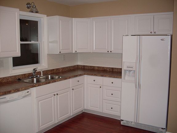 kitchen view with dishwasher and fridge