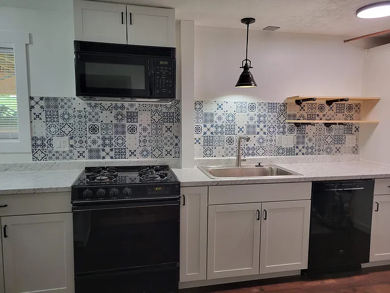 Downstairs extra-wide sink with garbage disposal