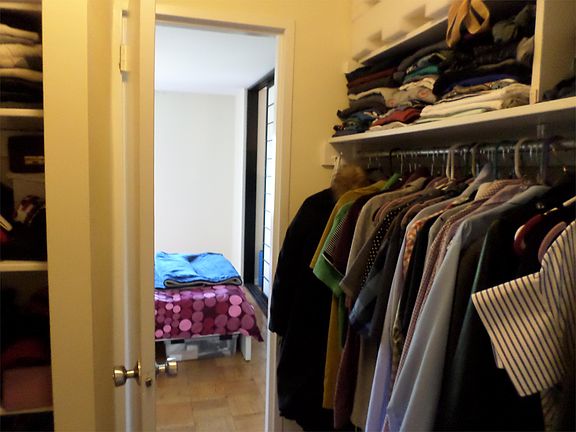 Walk-through closet from bedroom and bathroom