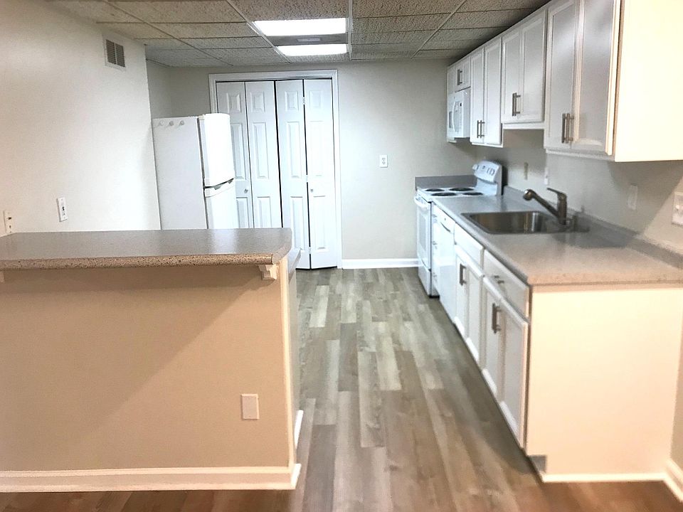 Kitchen with brand new cabinets, counters, dishwasher, stove/oven and microwave, plus a pantry