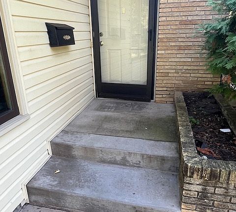 Front door. Doors are acoustically and thermally insulated, installed by the Metropolitan Airport Commission.
