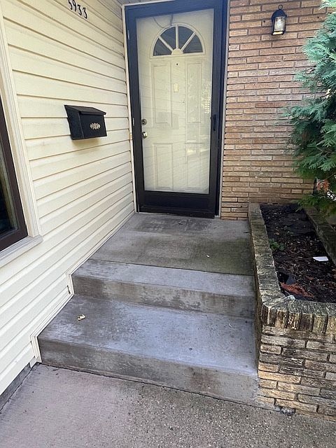 Front door. Doors are acoustically and thermally insulated, installed by the Metropolitan Airport Commission.