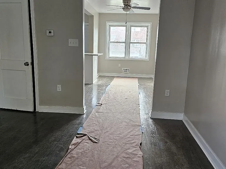 Standing in living room area looking into dining/kitchen