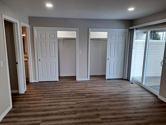His and Hers closets in primary bedroom
