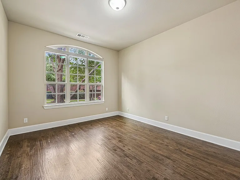 Another view of the office space with wood floors.