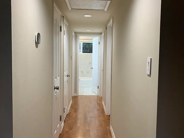 Hallway with two convenient storage closets