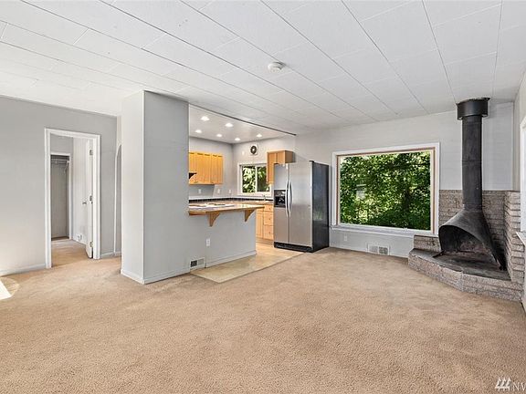 Living room opens to the kitchen with eating bar.  