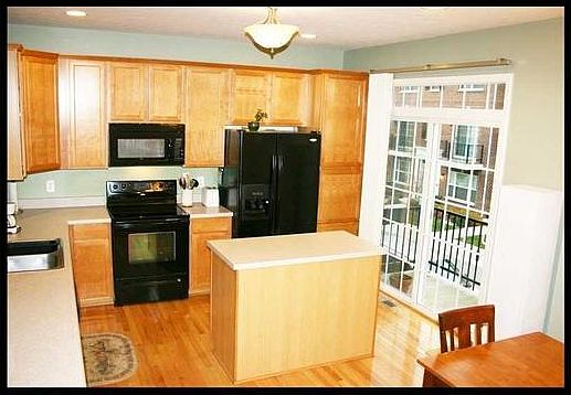 kitchen area with view of balcony