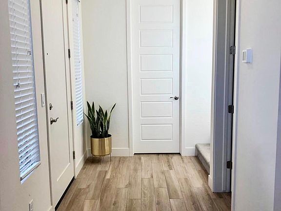Entryway and door to downstairs bedroom suite