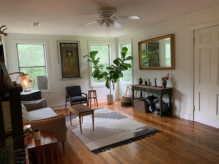 Living room with wood floors, fresh paint.