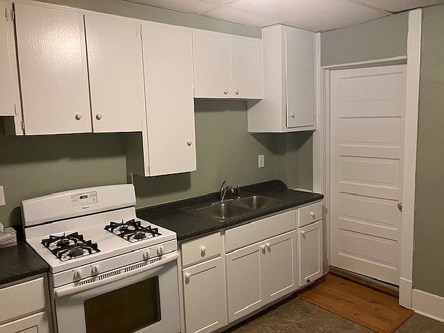East side of kitchen with door into full bathroom
