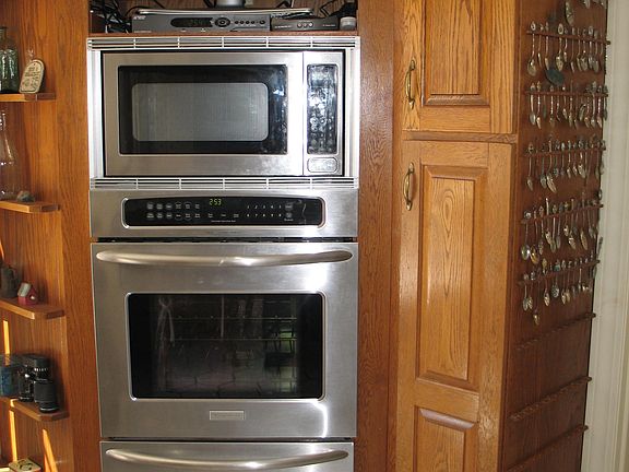 Conv. oven, warming oven with built in microwave and room for your TV