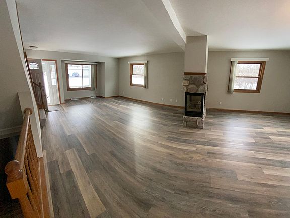 Wide angle kitchen to living room and dinette