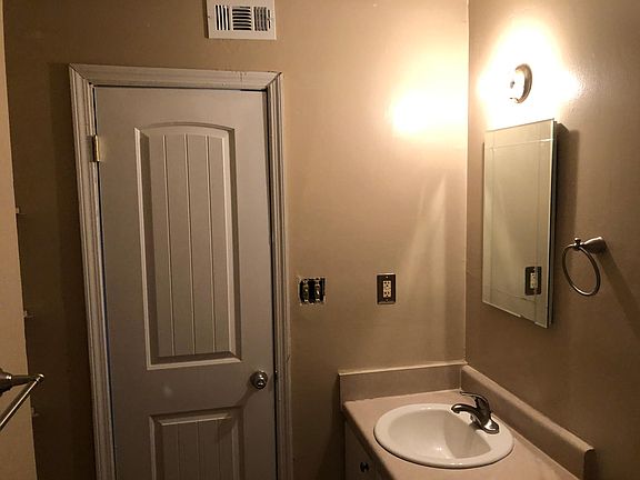 Bathroom-New hardware, paint, medicine cabinet, custom vinyl floor.