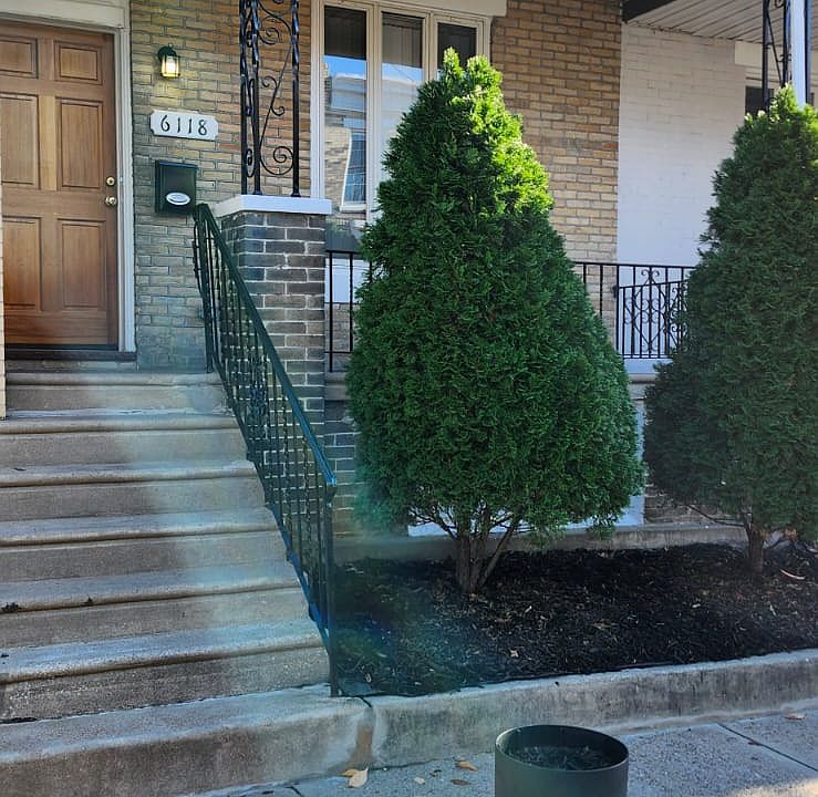 Landscaped front exterior with porch