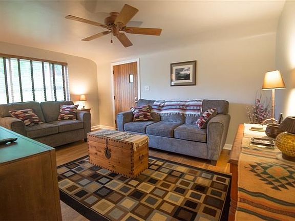 Additional view of living room with large picture window allowing a lot of natural light to come in.