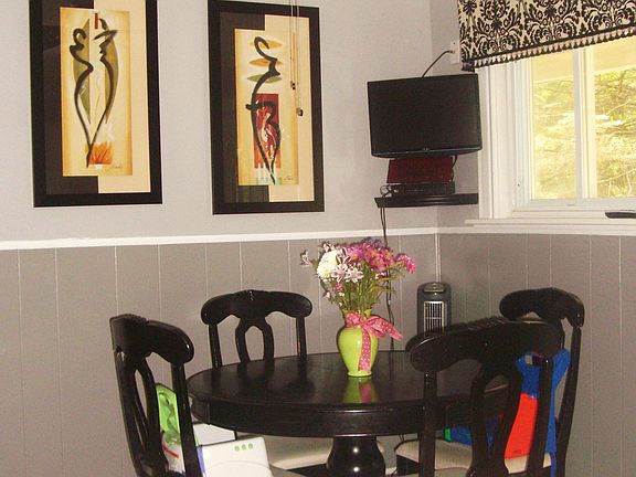 Eat in kitchen with professional decor.