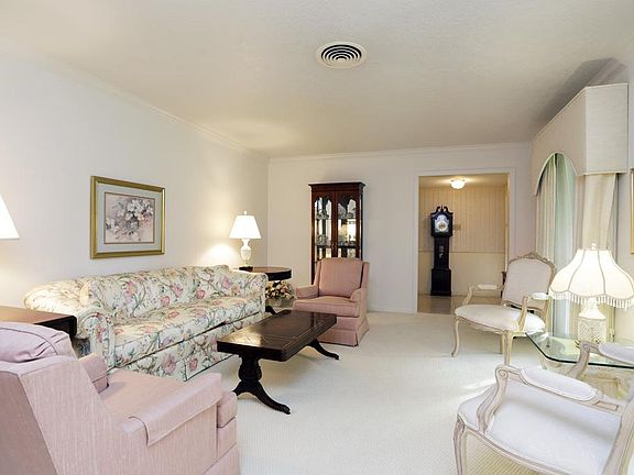 Sparkling living room ! custom drapes, fresh paint, lots of light !