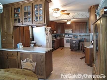 Kitchen and Dining area
						:
						Custom Amish-built oak cabinets with lots of storage