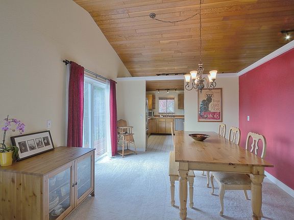 The picture angle is looking from the living room to the dining room. The door beyond is the entry t