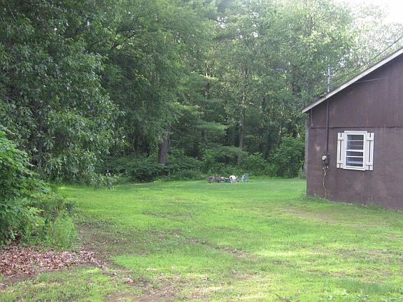 Two wooded acres with big back yard