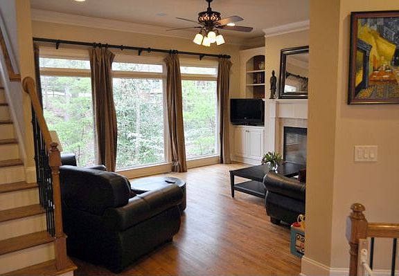 Another view of the living room with floor-to-ceiling windows