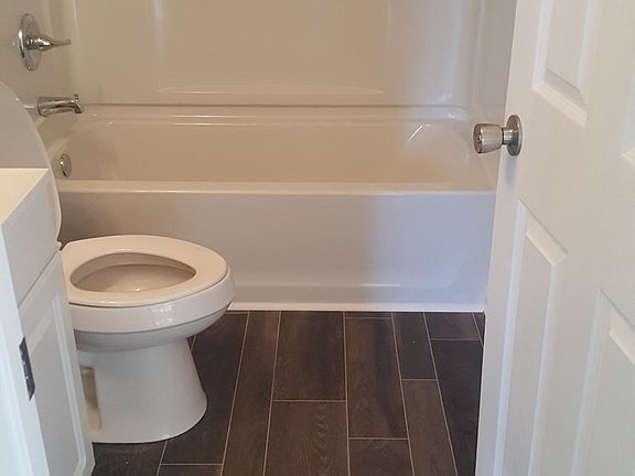 Hall bathroom, new floor, new tub, sink and toilet