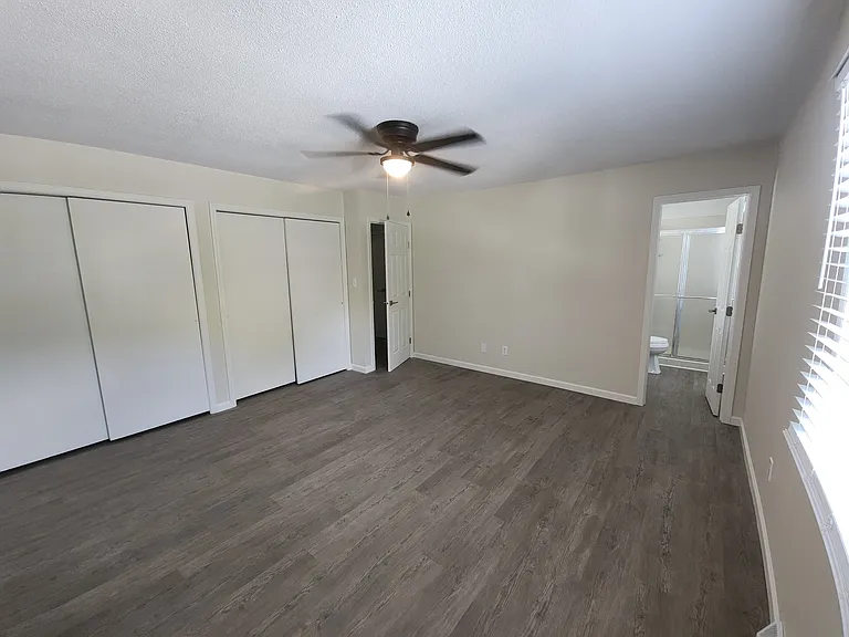 Master Bedroom and view of Master Bathroom (3rd bathroom), new ceiling fan