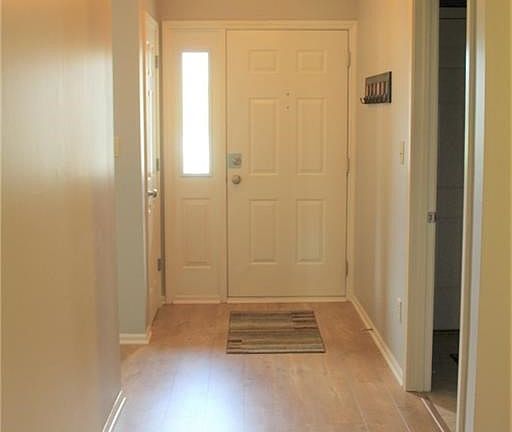 Entry hall and front door. Kitchen entry on the left and laundry room entry on the right (garage is entered thru laundry room).