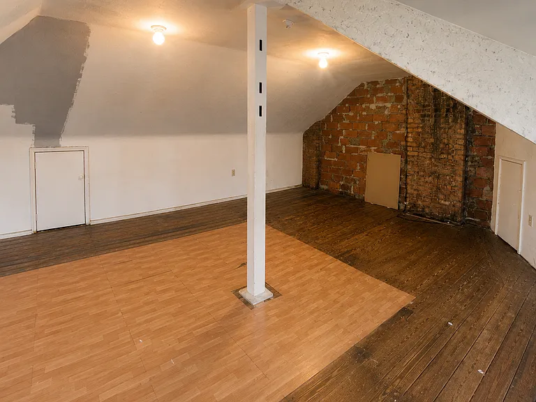 Finished attic. This is a great space for storage or light personal use, please note there are no closets or forced air ducts in this attic not recommended for bedroom use. Located on third floor of unit accessible only from Master Bedroom.