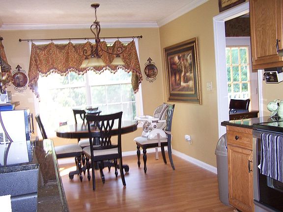 kitchen with granite countertops and custom drapes