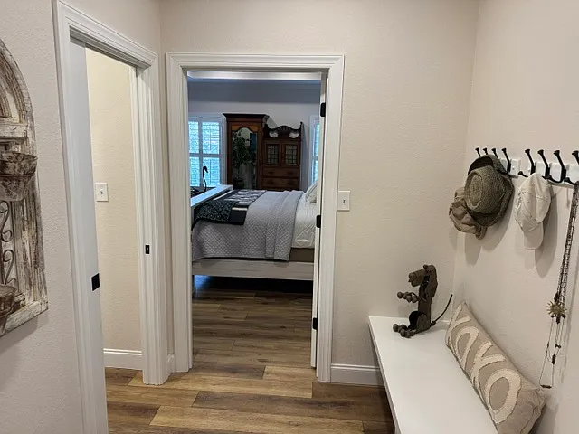 Garage entry to mud room with access to walk-in pantry, laundry room and primary bedroom