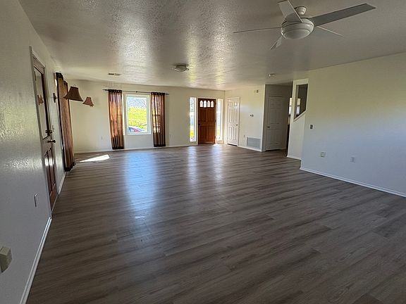 Great Room w/ new flooring and paint