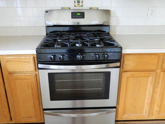 New stainless steel gas range