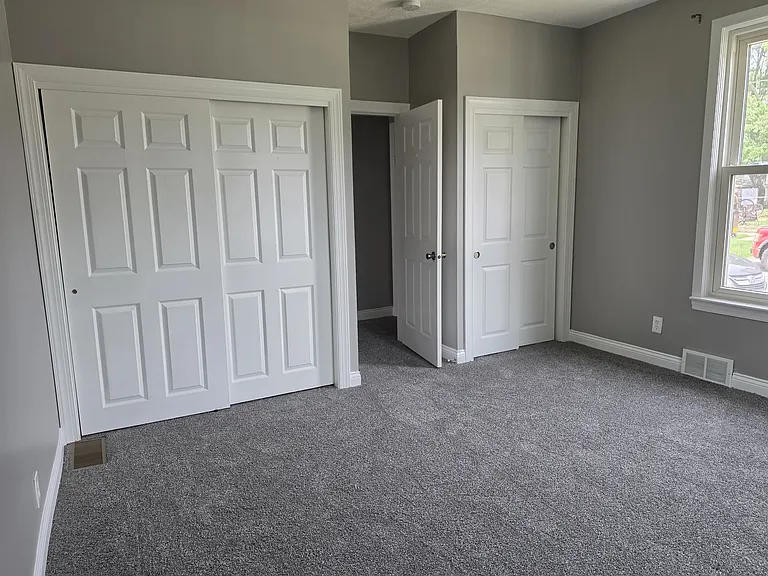 Bedroom 2 with his and her closets