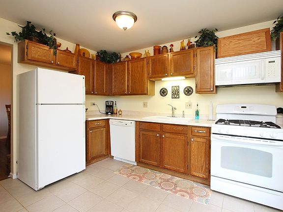 Bright Kitchen with all the appliances and another set of patio doors.