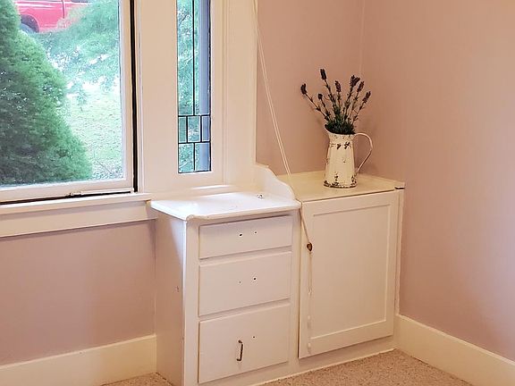 Bedroom #1 painted white with fir floors