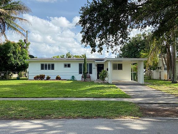 Covered Carport for One, Ample Parking for others.