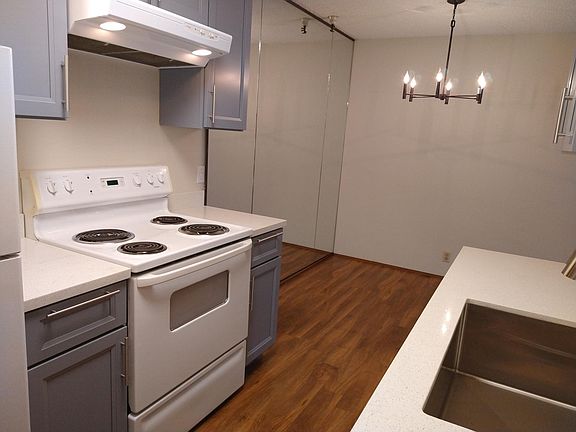 Mirrored dining area adjacent to kitchen