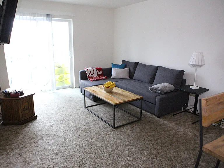 Living room has a private balcony!