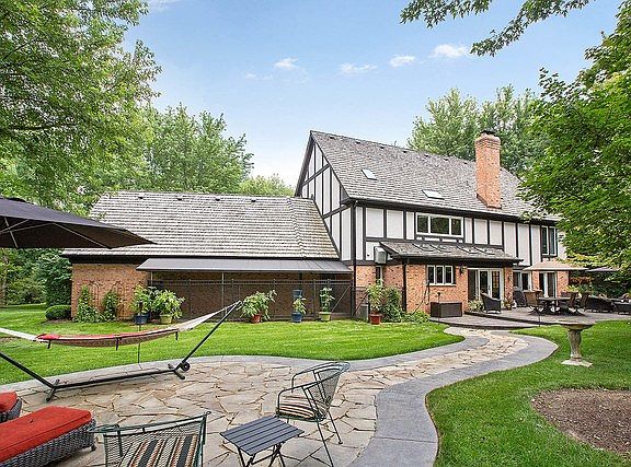 BACK YARD WITH 2 SEPERATE PATIO AREAS, BEAUTIFUL PLANTINGS