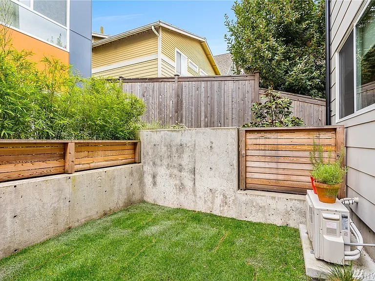 Fenced private space adjacent to kitchen (only available to this unit.)