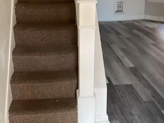 Walking in to the house the floors are all redown up stairs and down stairs