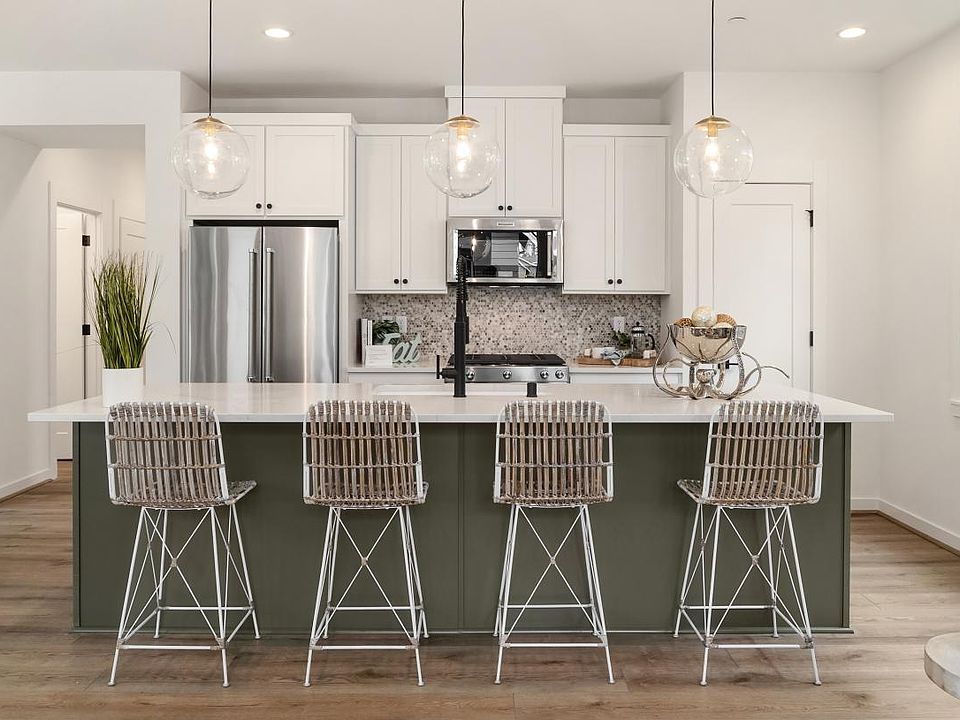 Large kitchen island provides seating for four