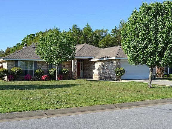 House sits on corner lot.