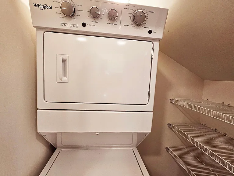 Large pantry with in-unit washer and dryer.