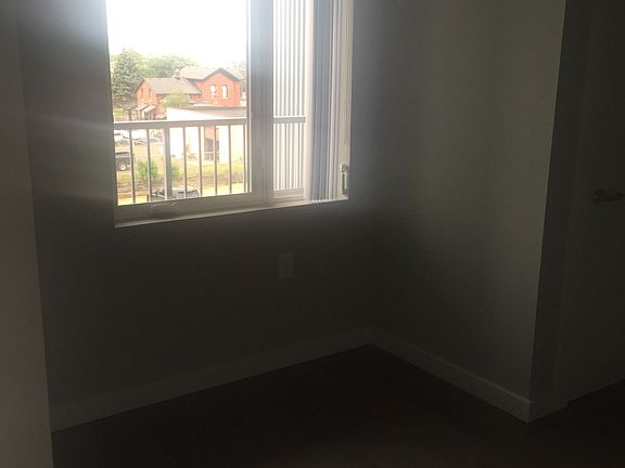 Bedroom w/ window over balcony