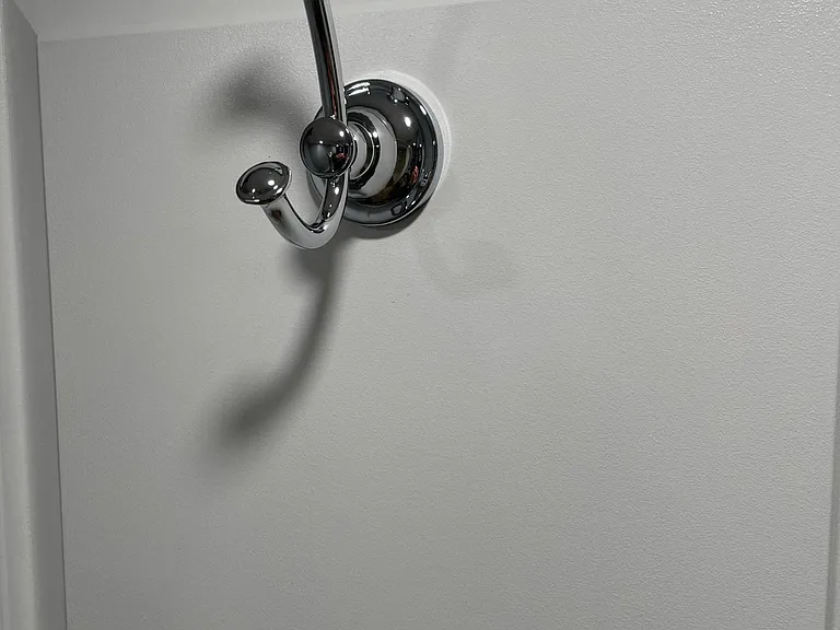 Also included is a stainless steel bathrobe hook on the bathroom door.